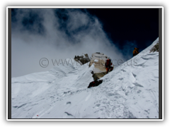 Climbers heading up the false summit