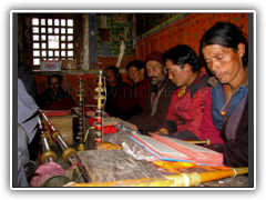 Monks performing a Puja ceremony in Sama Gaon
