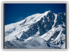 Good view of the summit ridge and Chinese and Inaki routes. 